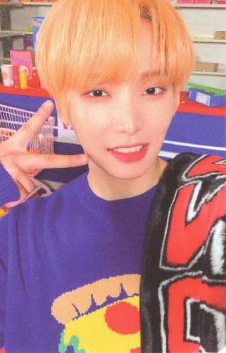 Photocard of Seoho wearing a purple sweater and holding up a peace sign