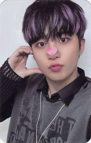 Jongho with a heart sticky note on his nose making a half heart against his cheek
