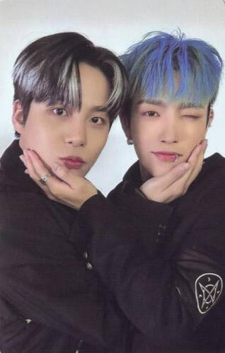 Photocard of Hongjoong and Jongho holding each other's faces