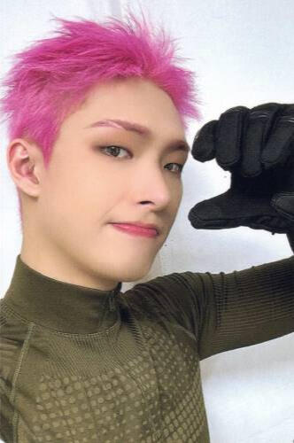 Photocard of Mingi wearing a green athletic shirt and thick black gloves, holding a hand by his face