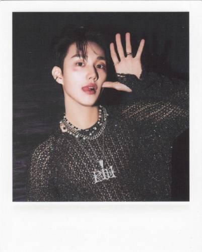Fake polaroid of Intak making a silly face in all black.