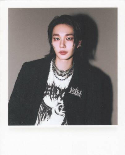Fake polaroid of Theo wearing a black jacket