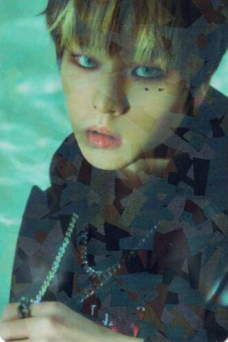 Reflective photocard of Dohyon wearing a black jacket and gazing into the camera
