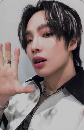 Photocard of Muzin with his mouth slightly open and his hand held up