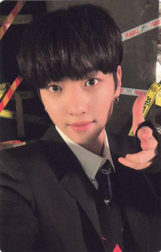 Photocard of Yujun making a finger gun at the camera with a light smile