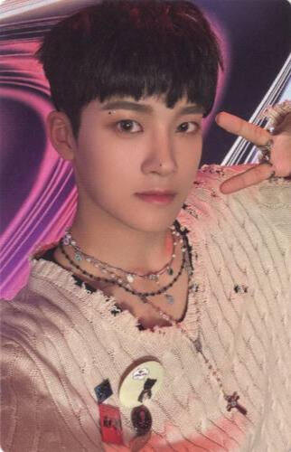 Photocard of Junmin wearing a ragged white sweater and making a peace sign