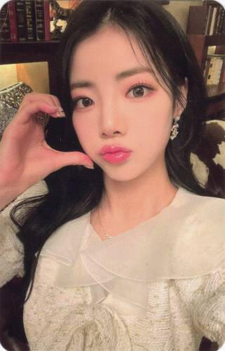 Photocard of Goeun making a cheek heart