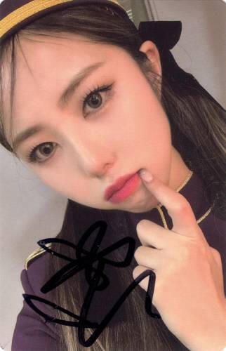 Signed photocard of Ireh poking her cheek