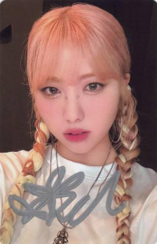 Signed photocard of Ireh with two braids on her shoulders