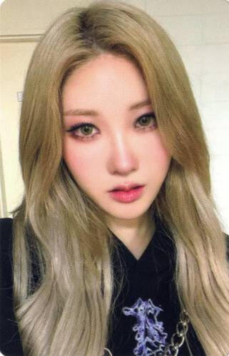 Photocard of Chaein wearing a black jacket and gazing into the camera
