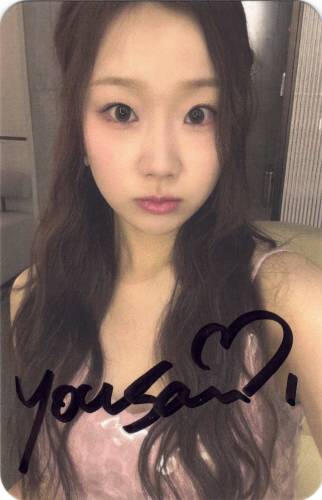 A signed photocard of Yousom staring at the camera