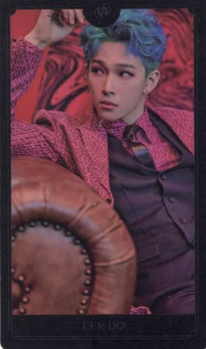 Card of Leedo wearing a black and pink suit and lounging on a couch