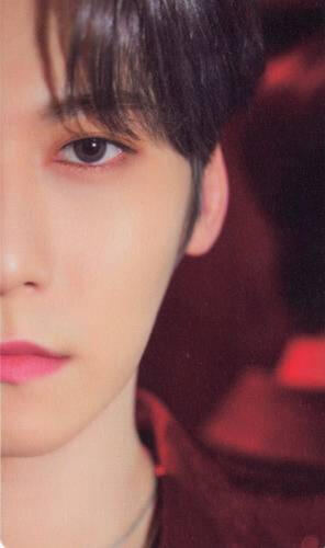Card of half of Keonhee's face as he looks into the camera