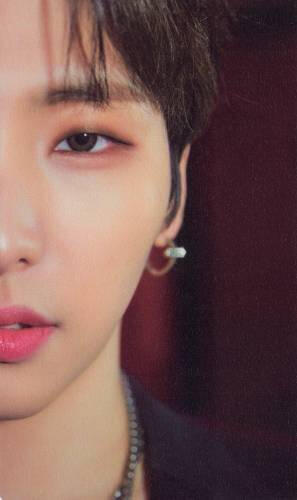 Card of half of Seoho's face as he looks into the camera