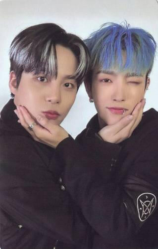 Photocard of Hongjoong and Jongho holding each other's faces