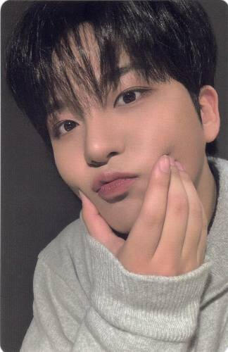 Photocard of Jongho wearing a grey jacket and squishing his cheeks