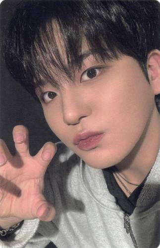 Photocard of Jongho in a grey jacket making a clawed hand