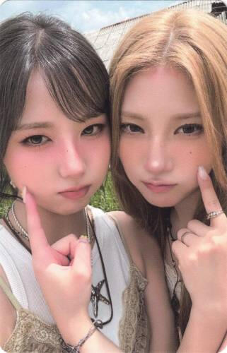 Photocard of Ireh and Chaein poking each other's cheeks
