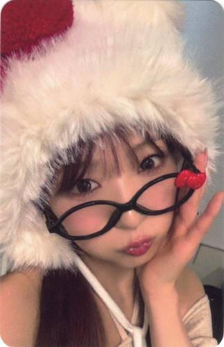 Photocard of Yume wearing a hello kitty hat and glasses