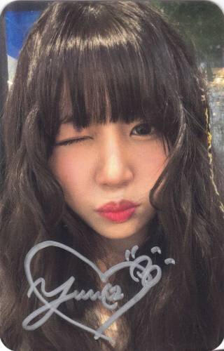 Signed photocard of Yuna making a kissy face and winking