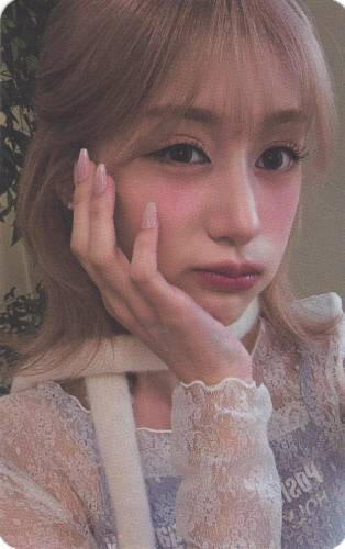 A photocard of Chaei pouting