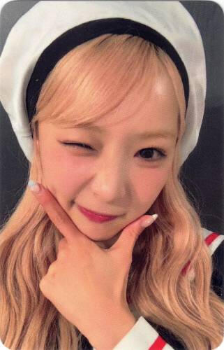 Photocard of Yuma in a sailor outfit winking