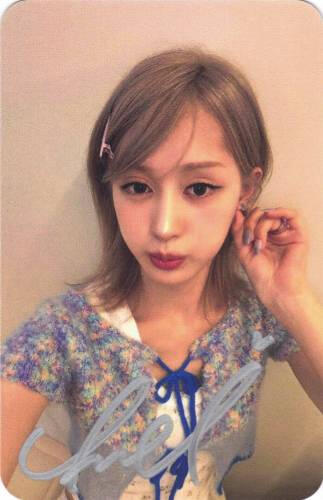 Signed photocard of Chaei holding her earring