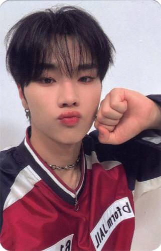 Photocard of Jungsu in a racing shirt and holding a fist to his cheek