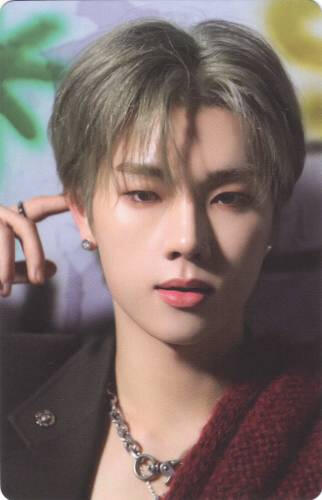Photocard of Jungsu wearing a black and red suit while staring into the camera
