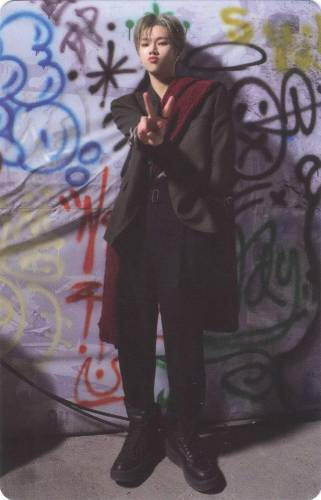 Photocard of a full body picture of Jungsu wearing a black and red suit while holding up a peace sign