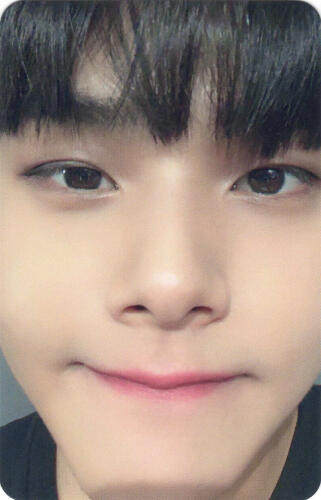 A photocard of Jahan very up close to the camera