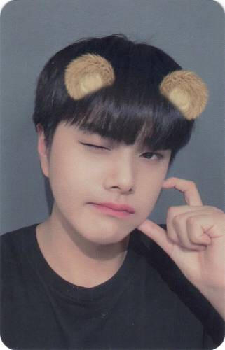 Photocard of Jahan winking, making a heart on his cheek, and wearing bear ears
