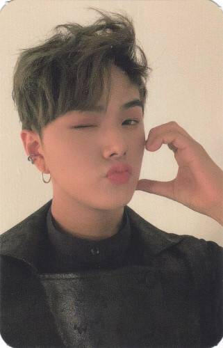 Photocard of Jahan making a cheek heart and winking
