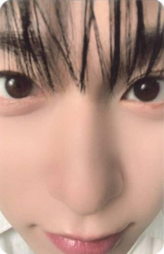 Photocard of a really close up of Keonhee staring at the camera
