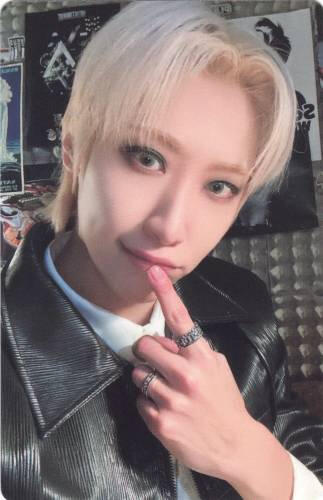 A photocard of Dongmyeong poking his lips