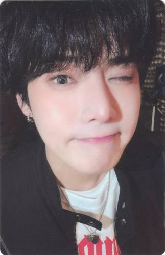 A photocard of Yonghoon with a dorky wink
