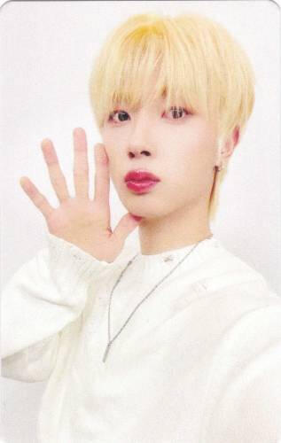 Photocard of Kanghyun holding an open palm by his face