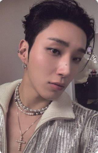 Photocard of Jongup wearing a silver jacket, pearl chokers, and a cross necklace