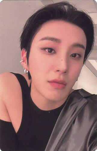 Photocard of Moon Jongup wearing a black shirt with shoulder cutouts and a black leather jacket falling off one shoulder