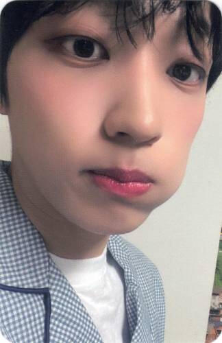 Photocard of Arthur wearing pajamas and putting his tongue in his cheek