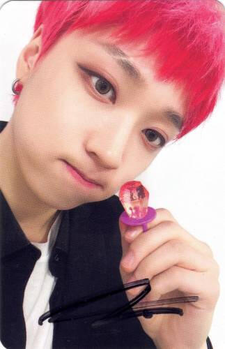 A signed photocard of Arthur holding a ring pop