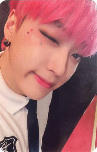 A photocard of Arthur winking up close to the camera