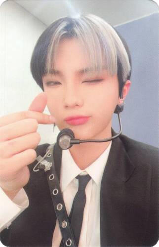 Photocard of Chiwoo wearing a microphone, making a finger heart, and winking