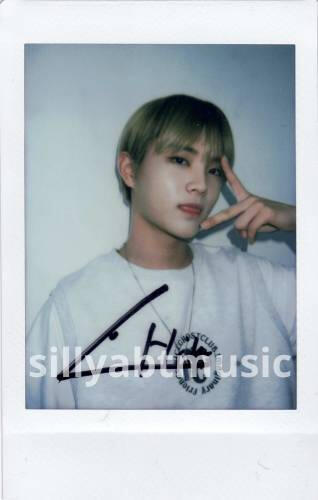 A signed polaroid of Chiwoo making a peace sign