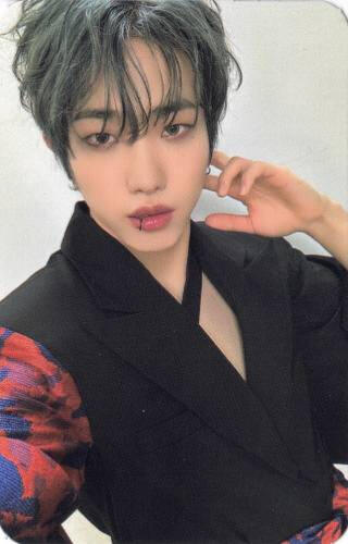 Photocard of Dann wearing a kimono-inspired floral jacket with a lip ring