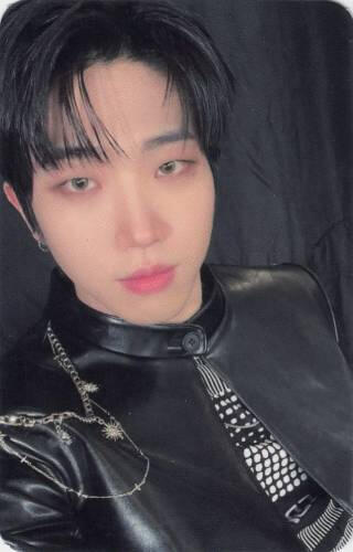 Photocard of Dann in a black leather jacket and racing shirt