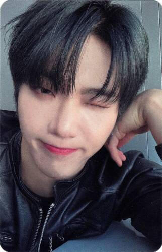 Photocard of Hwon making a dorky wink