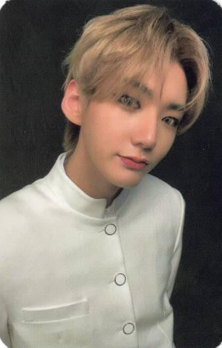 Photocard of Hwon wearing a white coat and looking into the camera