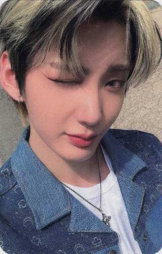 Photocard of Hwon wearing a jean jacket and winking