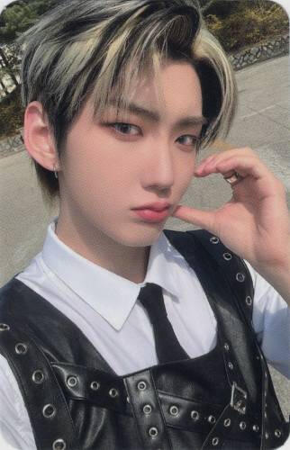 Photocard of Hwon making a half heart on his cheek